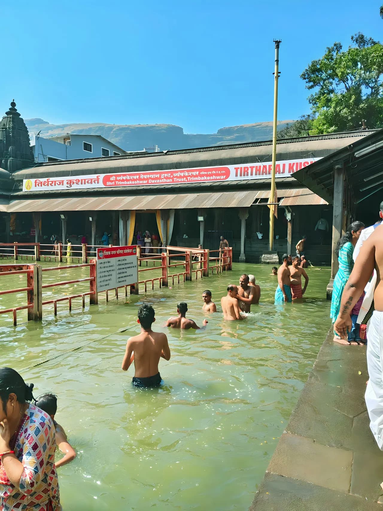 Pilgrims bathing in Kushavarta Kund, Trimbakeshwar