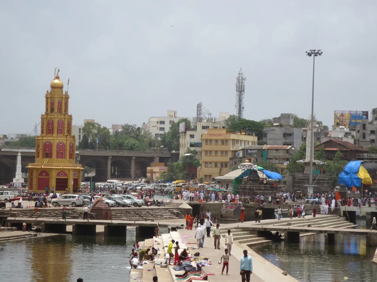 Ramkund on the Godavari river in Panchavati, Nashik, with ghats, temple spire and pilgrims