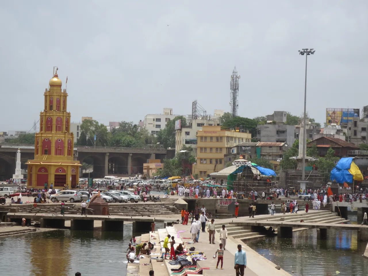 Ramkund on the Godavari river in Panchavati, Nashik, with ghats, temple spire and pilgrims